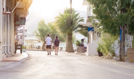 young couple is walking through a tourist resortの写真素材