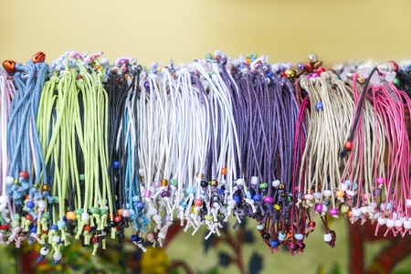 Different friendship bracelets in a shopの写真素材