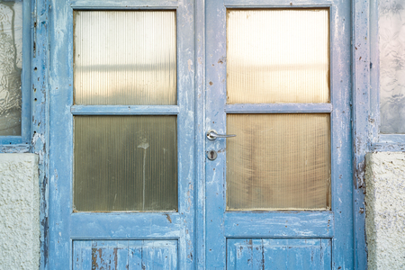 old blue greek door and windows