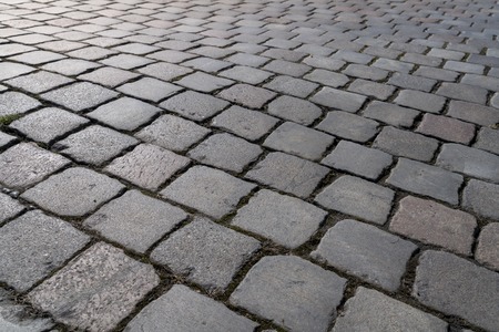 closeup of a cobblestone road for backgroundsの写真素材