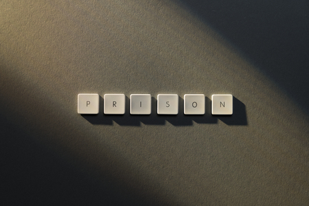 description of the word Prison with the letters of an old keybordの写真素材