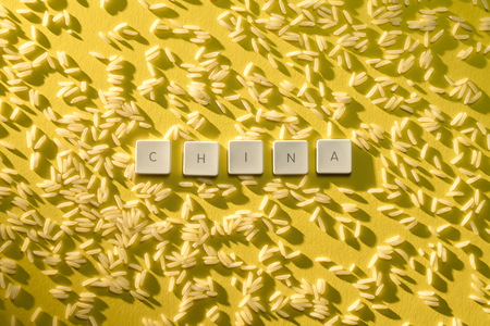 the letters china with a yellow rice backgroundsの写真素材