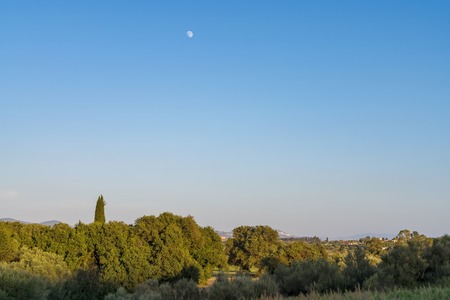 Mediterranean Greek landscape with moonの写真素材