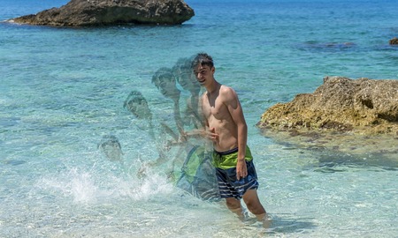double exposure, young man falling into the seaの写真素材