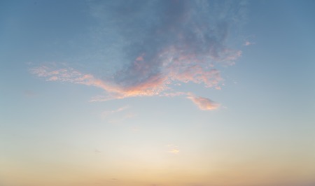 some light clouds in the light of a sunset, for backgroundsの写真素材
