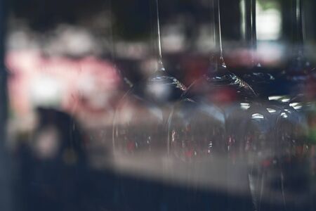 close up of blurred vine glasses behind a windowの写真素材