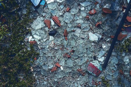 shards of smashed roof tiles and glass covering the floorの写真素材