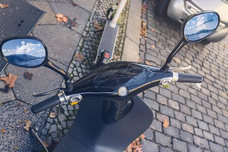 electric scooter from above with exchanged mirror images in the rearview mirrorsの写真素材