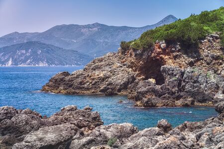 landscape with rocky coast near the city of ammoundia, greeceの写真素材