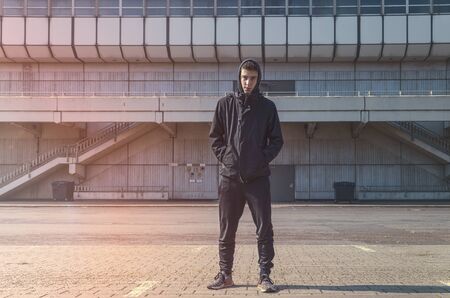 portrait of a young man with black hoodieの写真素材