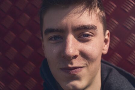 portrait of a lucky smiling young manの写真素材