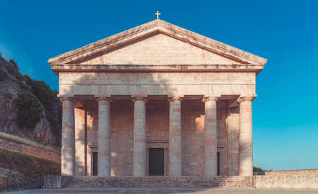 old greek temple in corfu with clear blue skyの写真素材