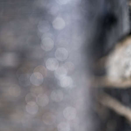 blurred water drops of a fountain for backgroundsの写真素材