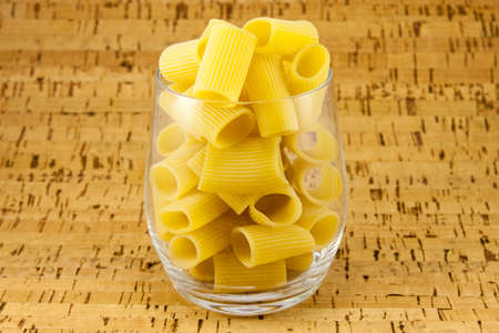 Ditaloni pasta inside transparent glassの写真素材