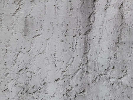 Old wall background close up. concrete wall texture . Textured stone sandstone surface.の写真素材