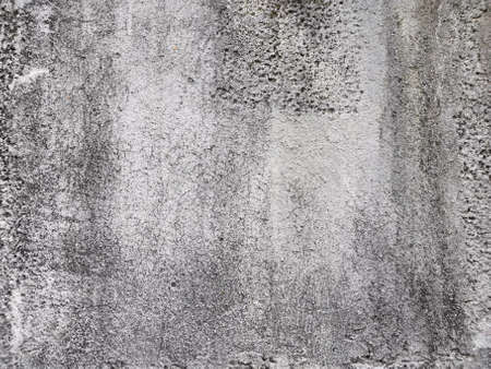 Old wall background close up. concrete wall texture . Textured stone sandstone surface.の写真素材