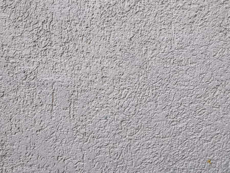 Old wall background close up. concrete wall texture . Textured stone sandstone surface.の写真素材