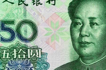 Fifty Chinese renminbi RMB bills. CNY background. Closeup of Mao Zedong . Chinese currency.の写真素材