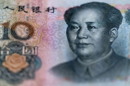 Ten Chinese renminbi RMB bills. CNY background. Closeup of Mao Zedong . Chinese currency.の写真素材