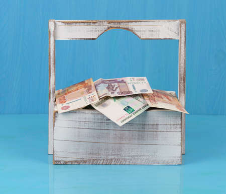 Russian ruble money in the wood basket for flowers. Shopping with happiness.の写真素材