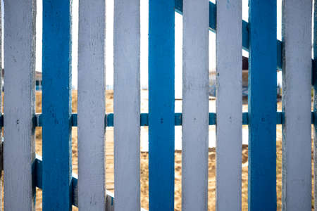 Wooden blue and white fence with  beach background .の写真素材