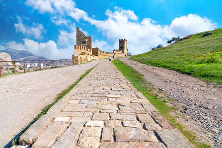 Old road paved  with large  stones in the mountains fortress.の写真素材