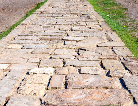 Old road paved  with large  stones in the mountains.の写真素材