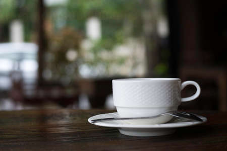 Cup of coffee on wooden desk, workspace or coffee break in morning, selective focus, Coffee...