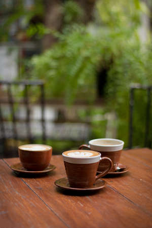 hot coffee on table, three cups of coffeeの写真素材