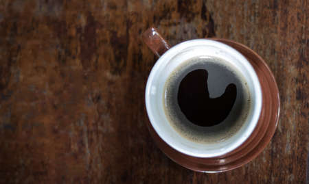 hot coffee on wood blackground , top view copy space