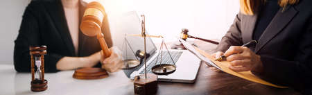 Justice and law concept.Male judge in a courtroom with the gavel, working with, computer and docking...