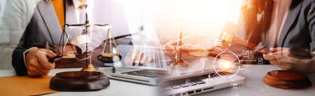 Justice and law concept.Male judge in a courtroom with the gavel, working with, computer and docking...