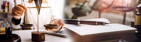 Business and lawyers discussing contract papers with brass scale on desk in office. Law, legal...