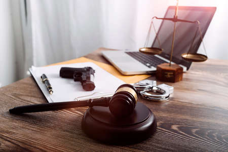 Business and lawyers discussing contract papers with brass scale on desk in office. Law, legal...