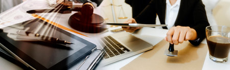 justice and law concept.Male judge in a courtroom on wooden table and Counselor or Male lawyer...