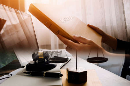 Business and lawyers discussing contract papers with brass scale on desk in office. Law, legal...