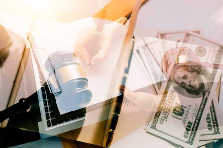 Business and lawyers discussing contract papers with brass scale on desk in office. Law, legal...