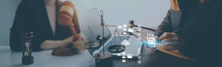 Justice and law concept.Male judge in a courtroom with the gavel, working with, computer and docking...