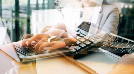 Businessman and team analyzing financial statement Finance task. with smart phone and laptop and...