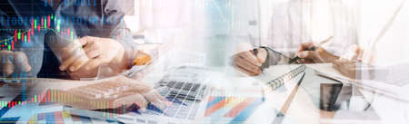 Businessman and team analyzing financial statement Finance task. with smart phone and laptop and...