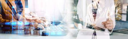 Businessman and team analyzing financial statement Finance task. with smart phone and laptop and...