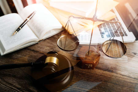 Justice and law concept.Male judge in a courtroom with the gavel, working with, computer and docking...
