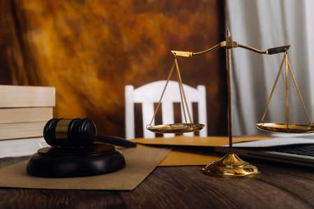 Justice and law concept.Male judge in a courtroom with the gavel, working with, computer and docking...