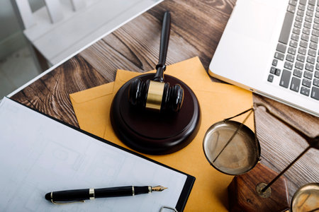 Justice and law concept.Male judge in a courtroom with the gavel, working with, computer and docking...
