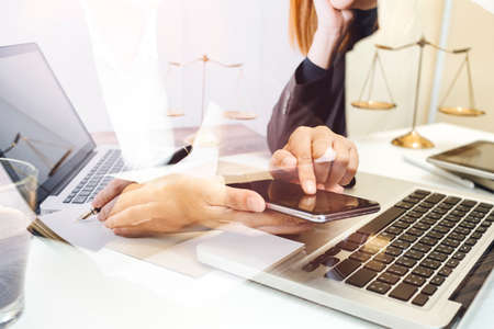 Business and lawyers discussing contract papers with brass scale on desk in office. Law, legal...