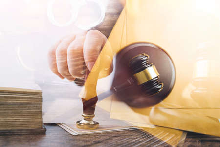 Business and lawyers discussing contract papers with brass scale on desk in office. Law, legal...