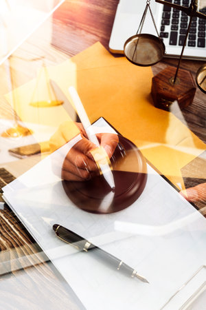 Business and lawyers discussing contract papers with brass scale on desk in office. Law, legal...