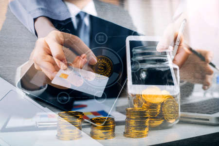 Hands holding credit card and using laptop. Online shopping