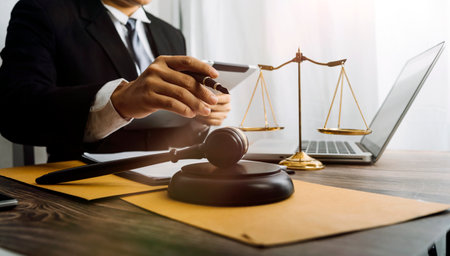 justice and law concept.Male judge in a courtroom on wooden table and Counselor or Male lawyer...