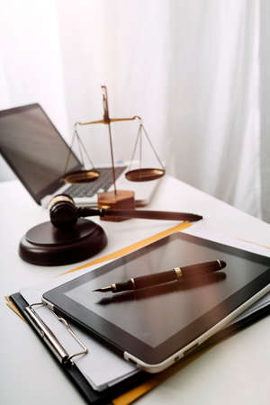 Business and lawyers discussing contract papers with brass scale on desk in office. Law, legal...